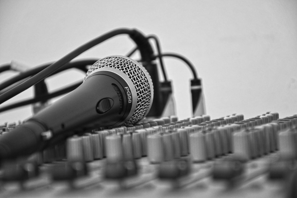 black & White microphone and cables and audio dials
